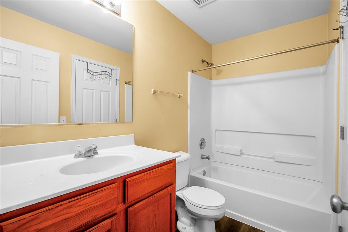 4932 Montauk Drive, Unit 4932 Plainfield, IL 60586 - Photo 17 of 23 a bathroom with a sink a toilet and shower