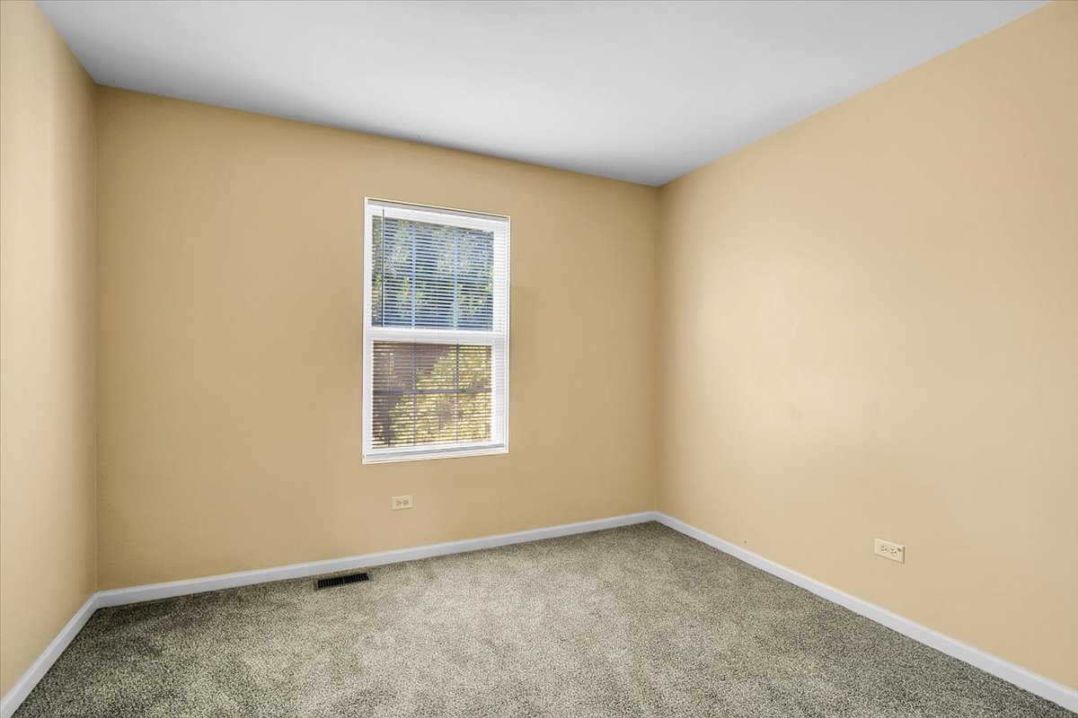 4932 Montauk Drive, Unit 4932 Plainfield, IL 60586 - Photo 18 of 23 an empty room with a window