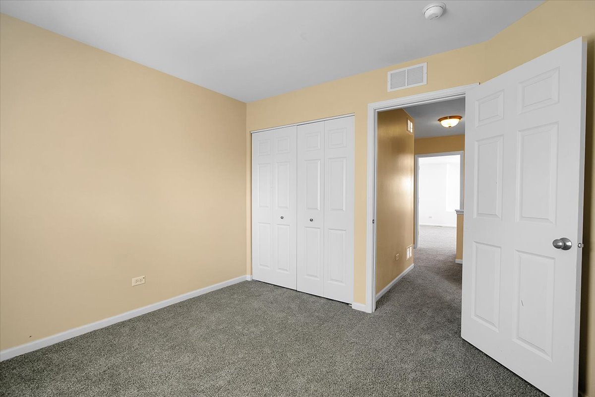 4932 Montauk Drive, Unit 4932 Plainfield, IL 60586 - Photo 19 of 23 a view of an empty room