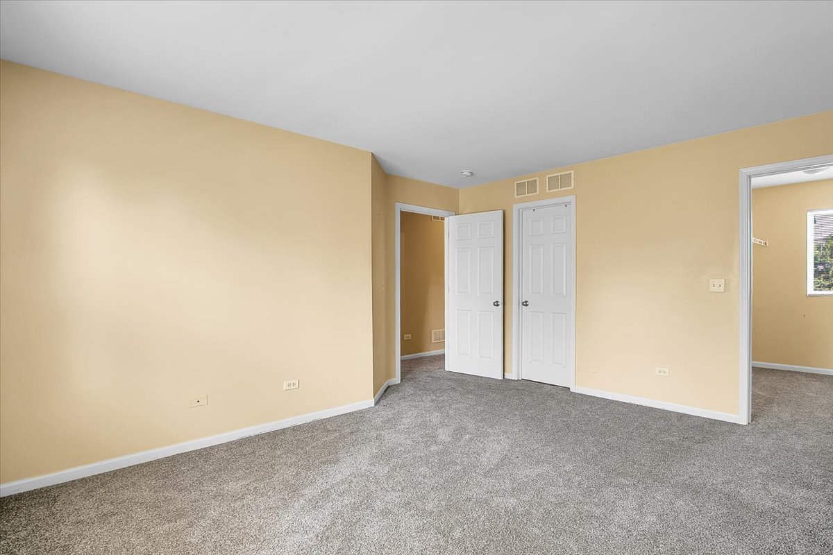 4932 Montauk Drive, Unit 4932 Plainfield, IL 60586 - Photo 21 of 23 a view of an empty room
