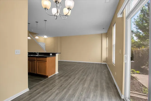 a view of kitchen and wooden floor