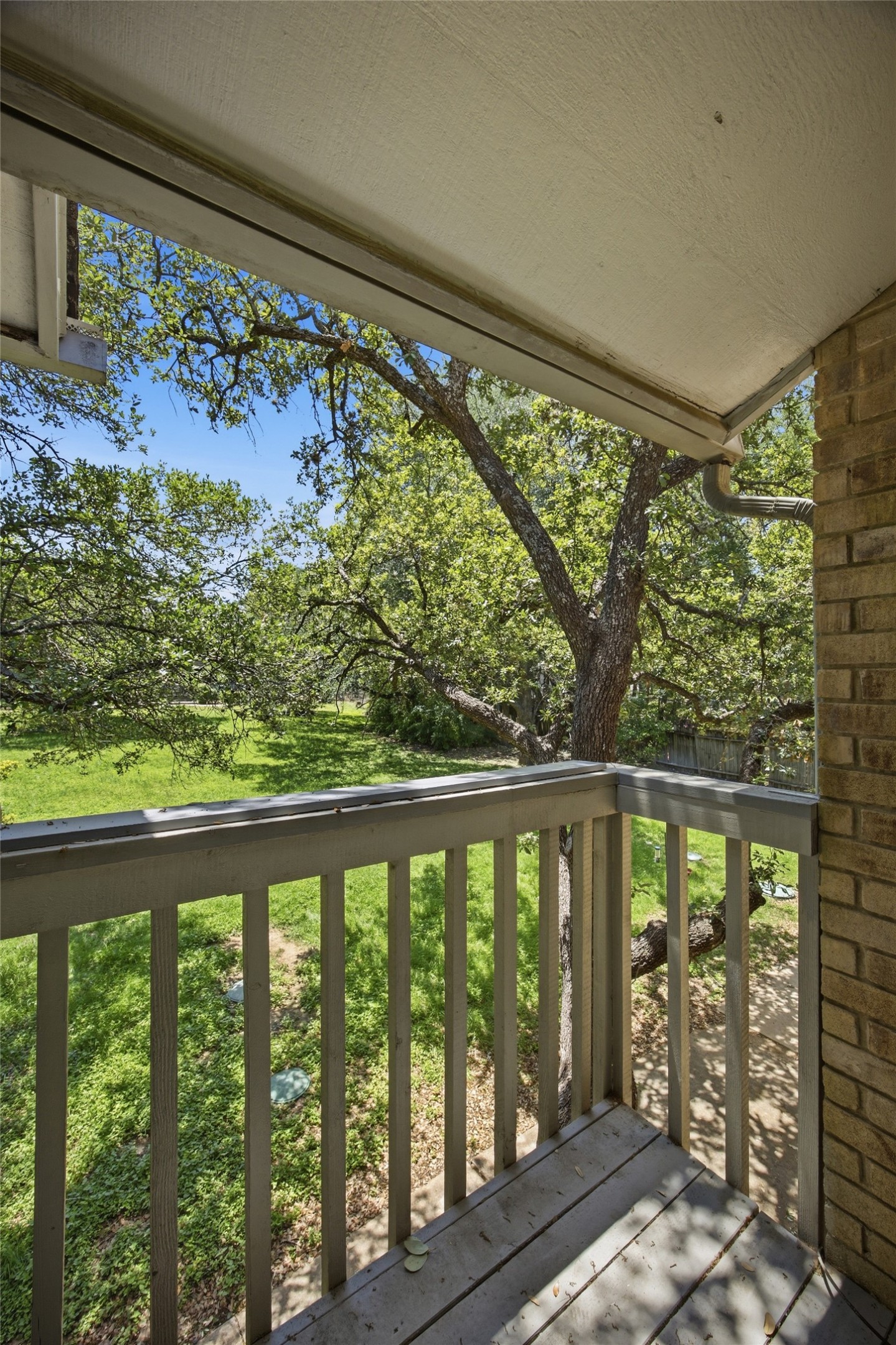 4204 Hudson Bend Road, Unit B Austin, TX 78734 - Photo 29 of 37 One of the bedrooms has an
Outdoor balcony featuring wood-finish flooring and a wood railing