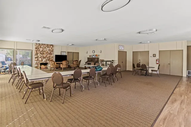 a group of people sitting at tables in a room
