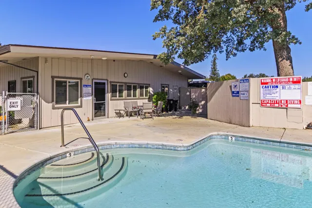 a view of a house with basketball court