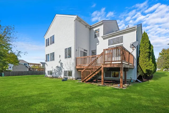 a view of house with a yard