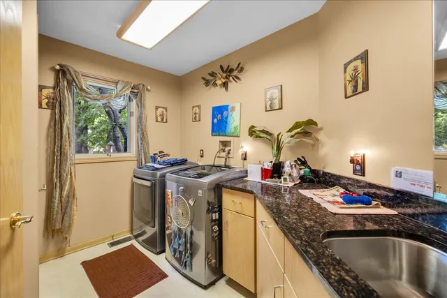 a kitchen view of a stove and a wooden floor