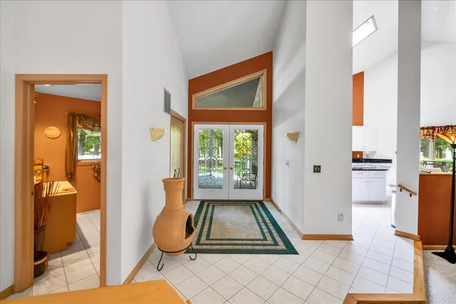 a room with window and a table chair