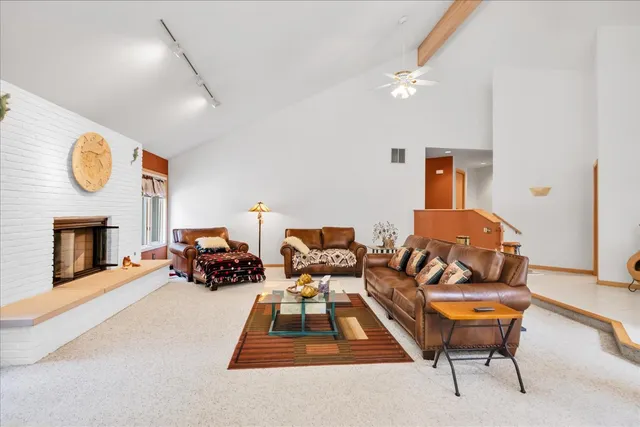 a bedroom with furniture and a fireplace