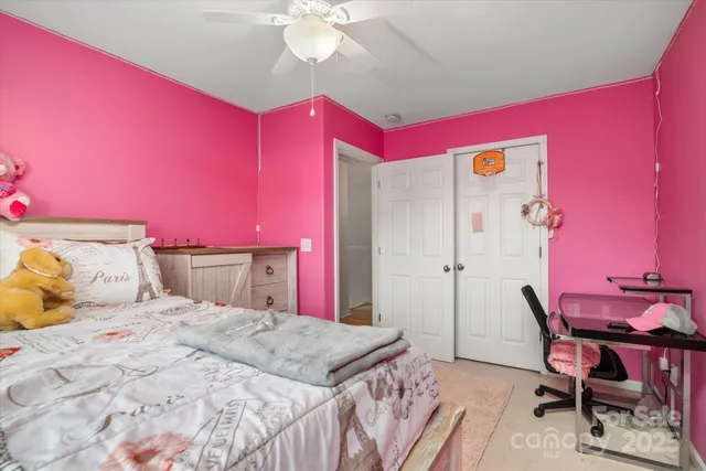 a bedroom with a bed and a table