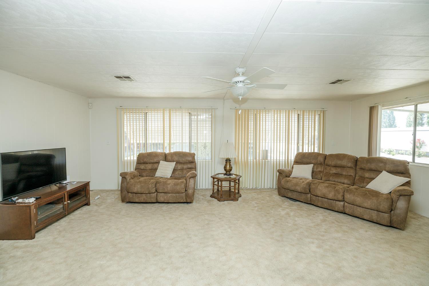 4837 Faith Home Road, Unit 4 Ceres, CA 95307 - Photo 11 of 42 a living room with furniture and a flat screen tv