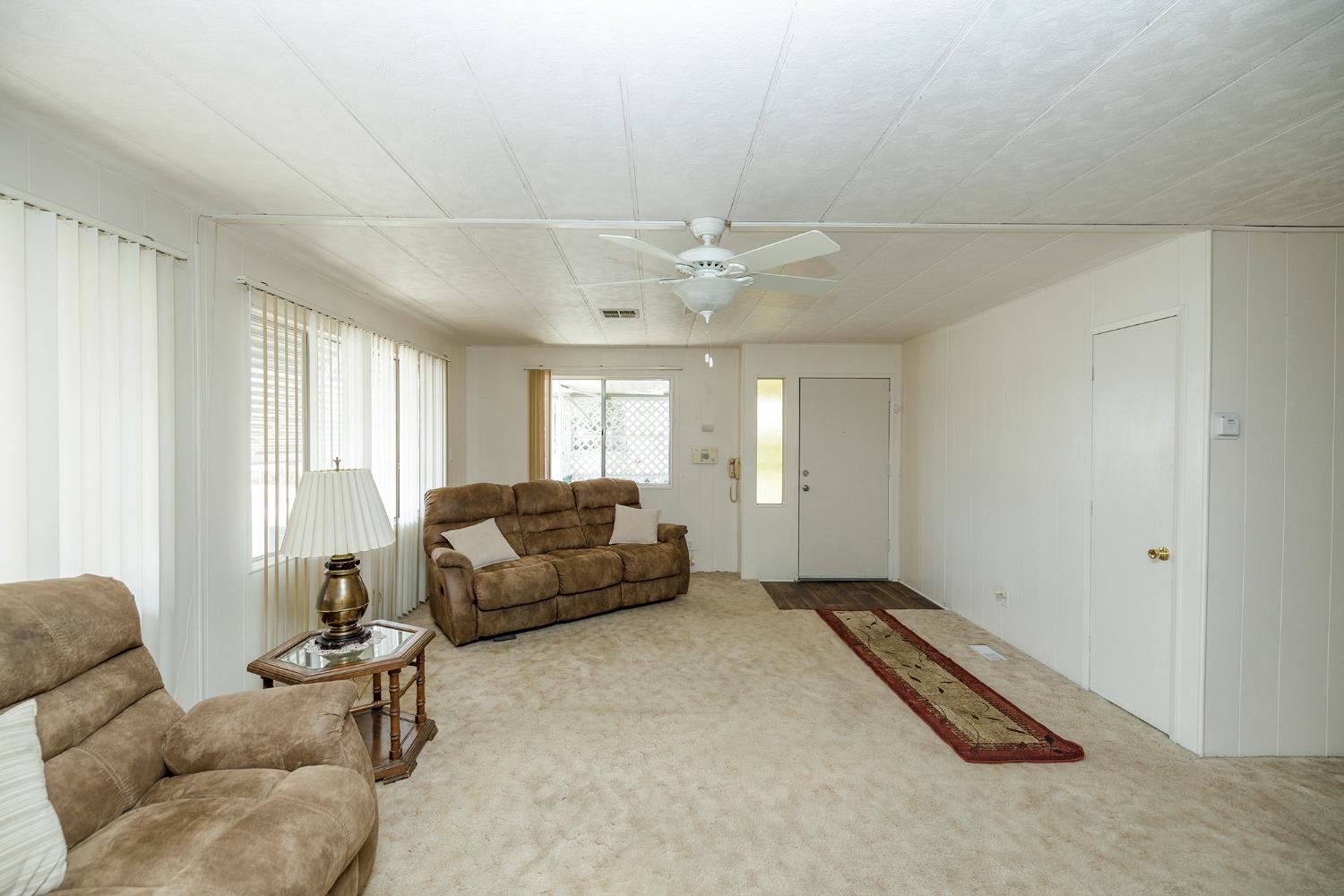 4837 Faith Home Road, Unit 4 Ceres, CA 95307 - Photo 13 of 42 a living room with furniture and a large window