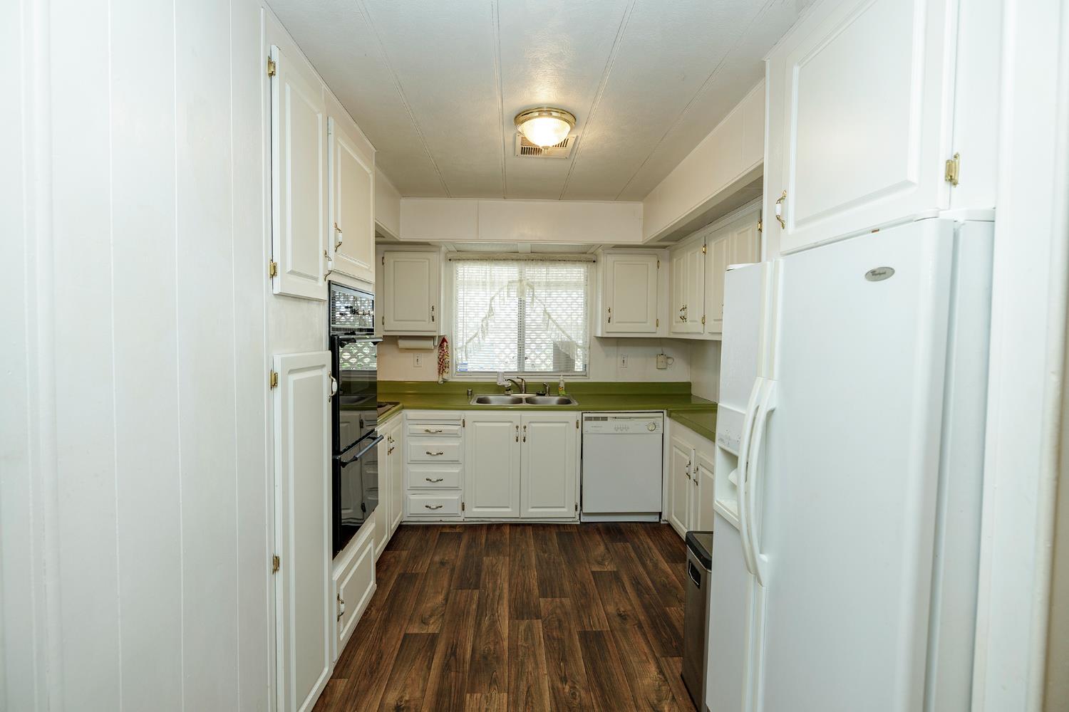 4837 Faith Home Road, Unit 4 Ceres, CA 95307 - Photo 17 of 42 a kitchen with cabinets oven and a dishwasher