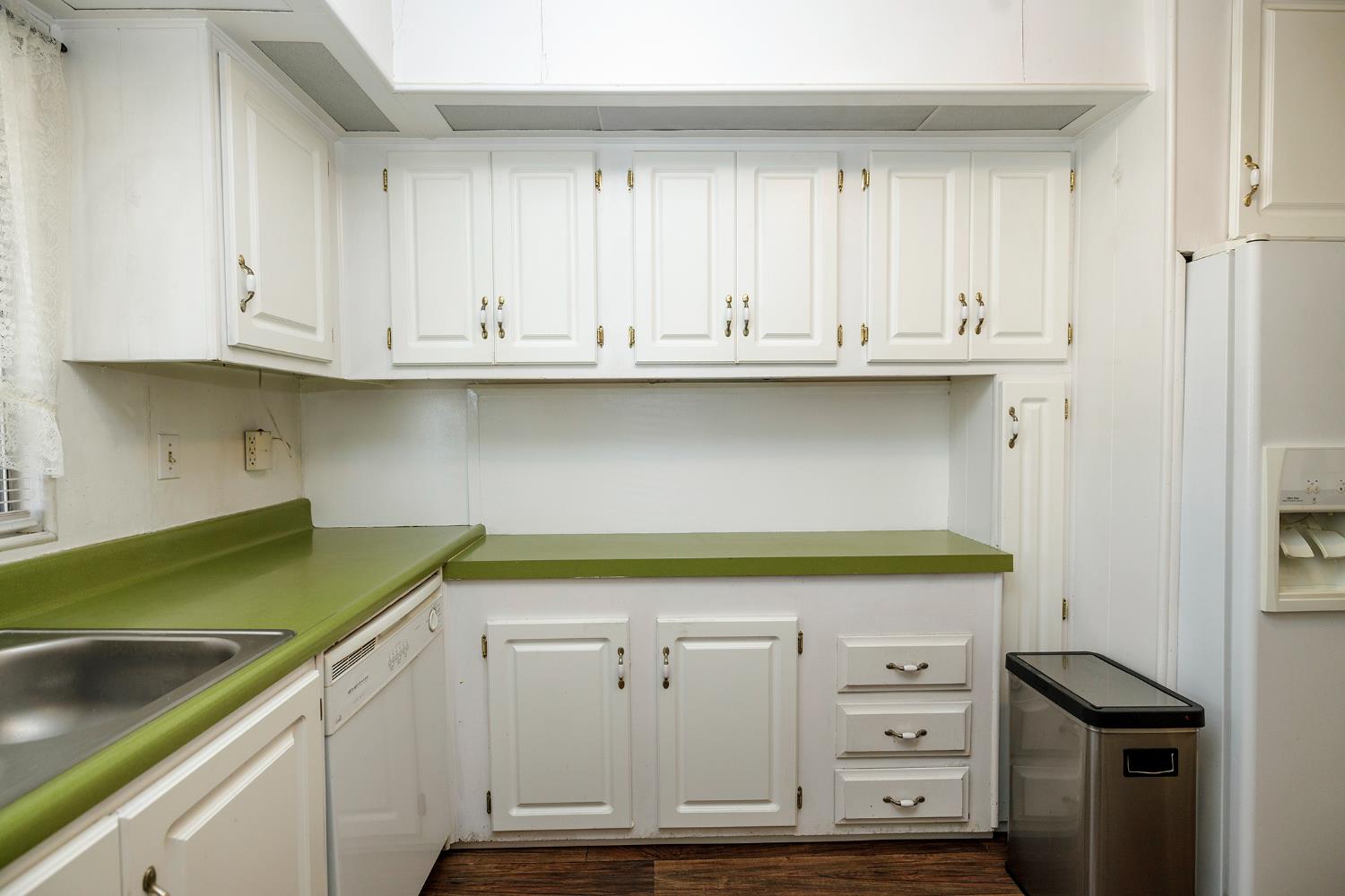 4837 Faith Home Road, Unit 4 Ceres, CA 95307 - Photo 19 of 42 a kitchen with white cabinets and a sink