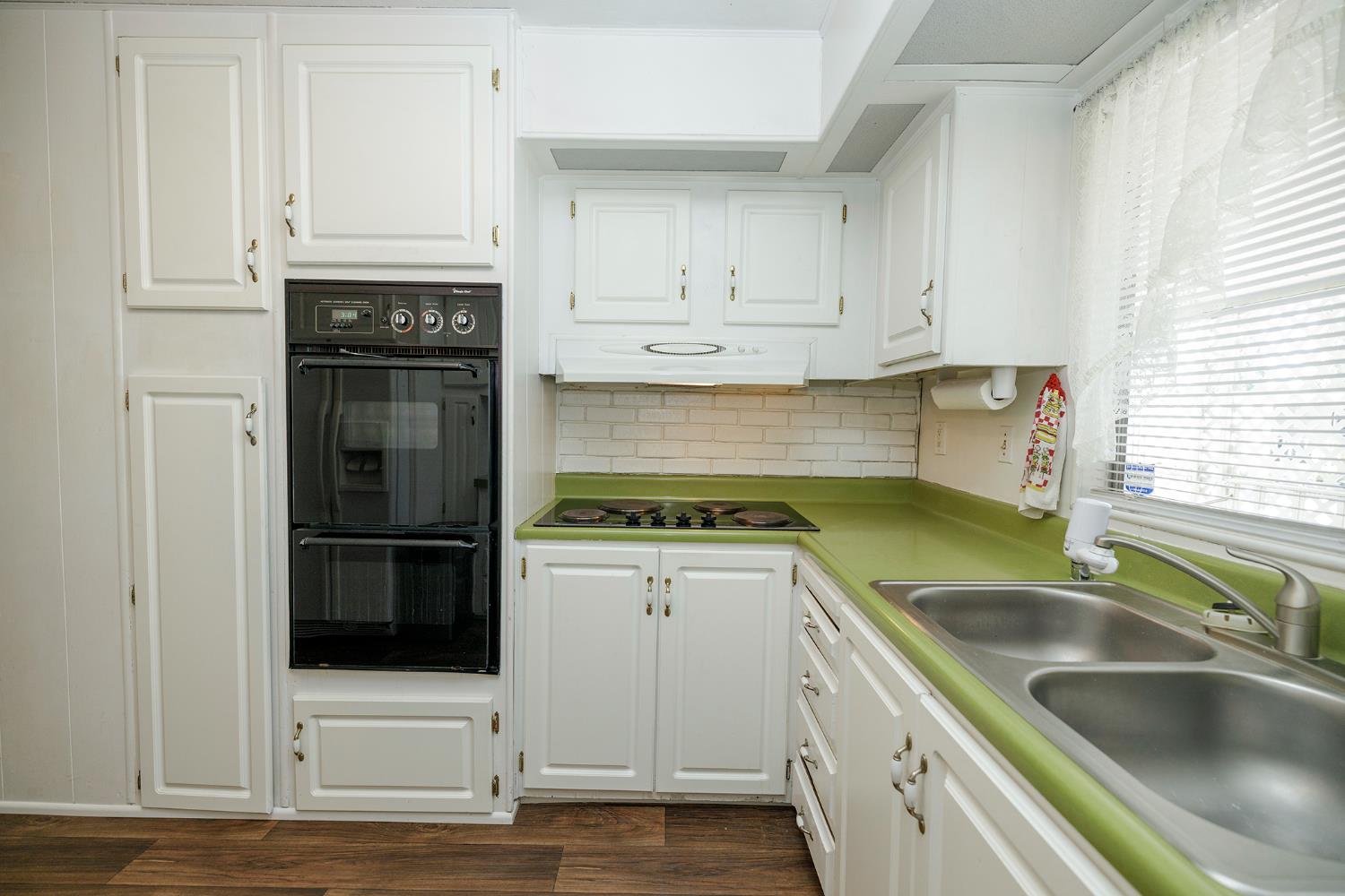 4837 Faith Home Road, Unit 4 Ceres, CA 95307 - Photo 20 of 42 a kitchen with stainless steel appliances granite countertop a sink stove and refrigerator