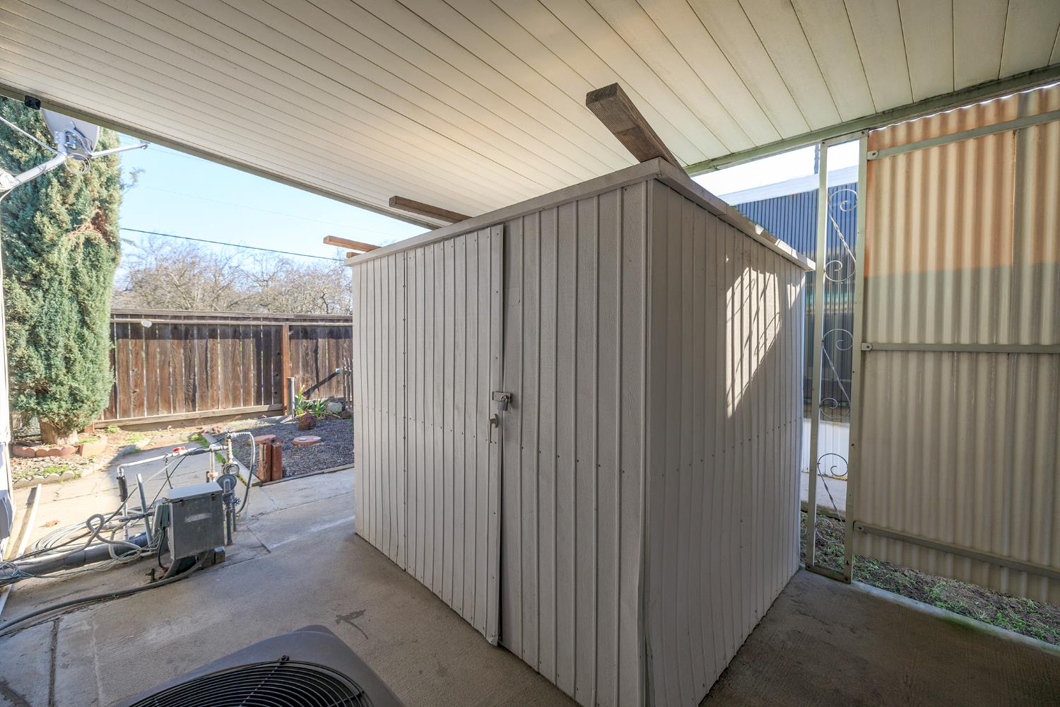 4837 Faith Home Road, Unit 4 Ceres, CA 95307 - Photo 34 of 42 a backyard of a house with table and chairs