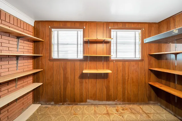 a view of room with window and wooden floor