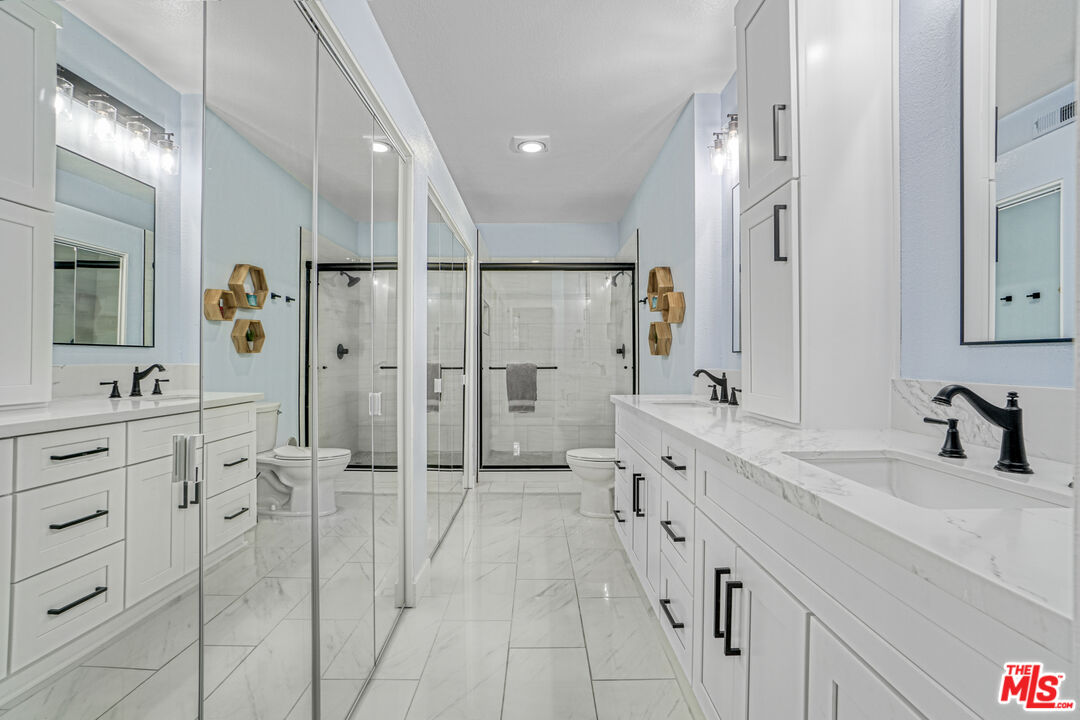 10401 Garden Grove Boulevard, Unit 44 Garden Grove, CA 92843 - Photo 16 of 26 a spacious bathroom with double sink and shower