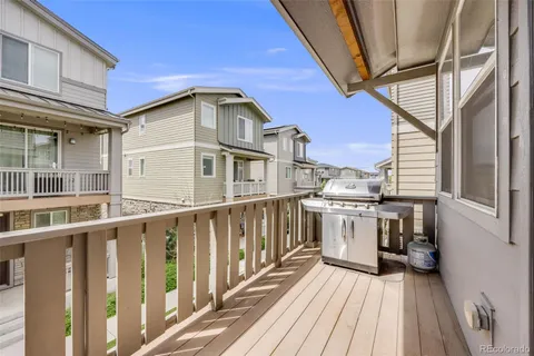 a view of a house with wooden deck
