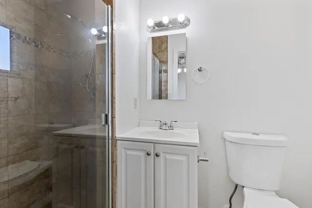 a house view with a sitting space and wooden fence