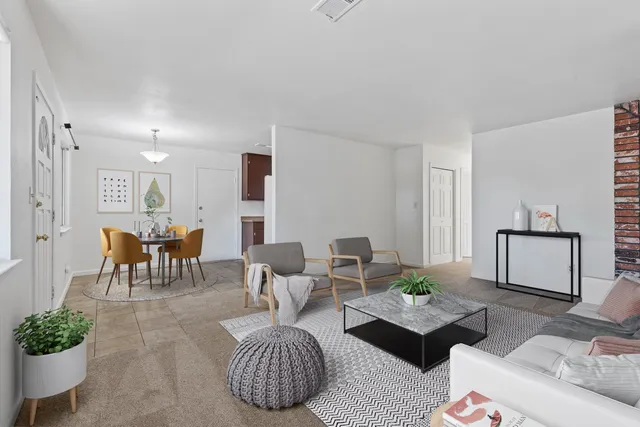 a living room with furniture and a table