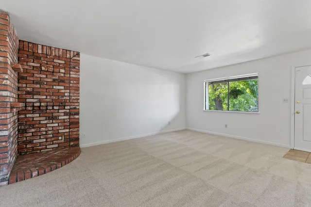 a view of an empty room and window