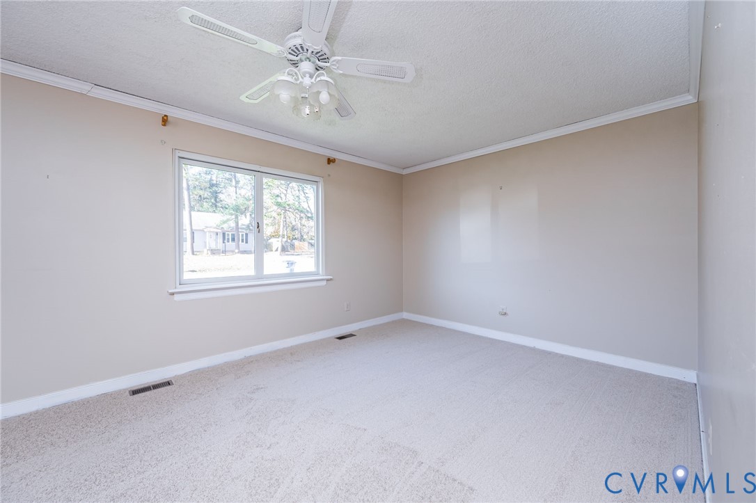 201 Monath Road Chesterfield, VA 23236 - Photo 11 of 30 an empty room with a window and a fan