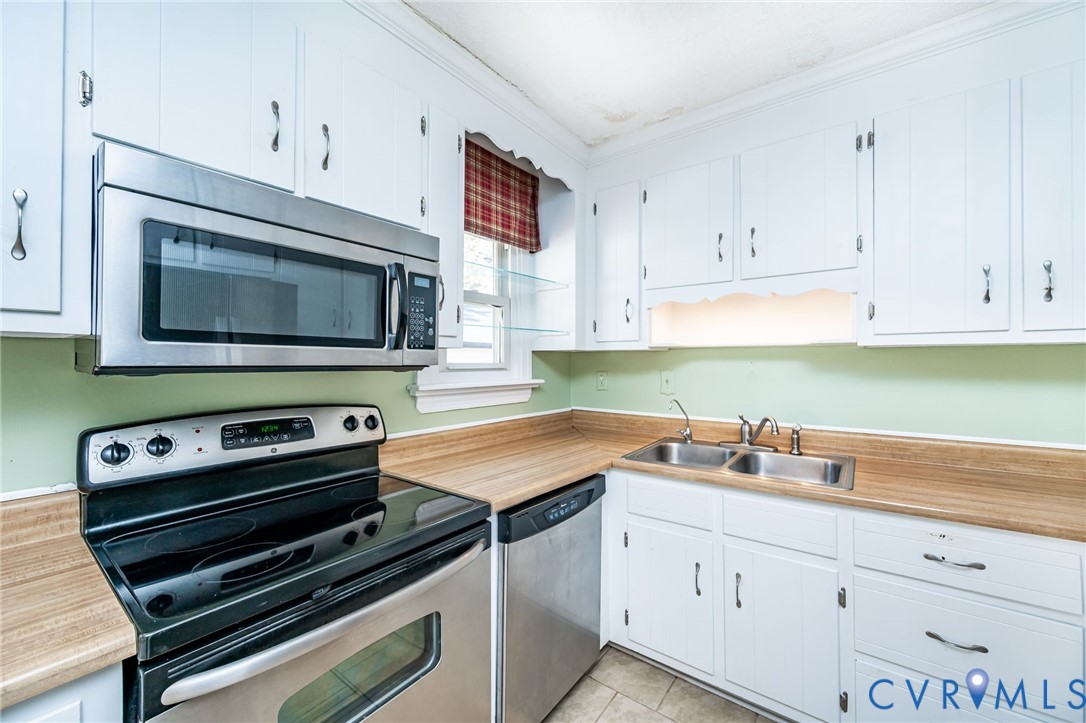 201 Monath Road Chesterfield, VA 23236 - Photo 15 of 30 a kitchen with a stove and a microwave