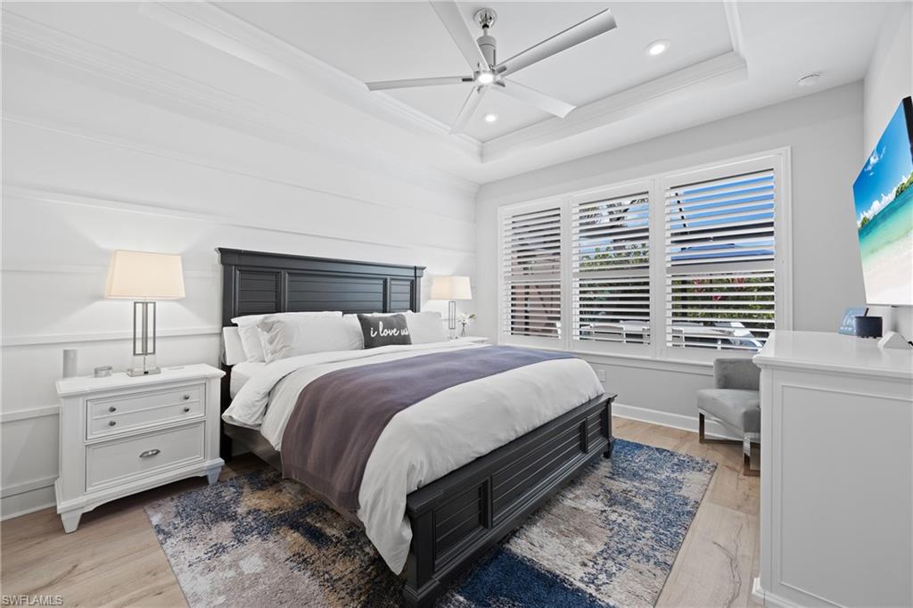 15214 Tolmino Street Naples, FL 34114 - Photo 14 of 47 a bed room with a bed and a chair