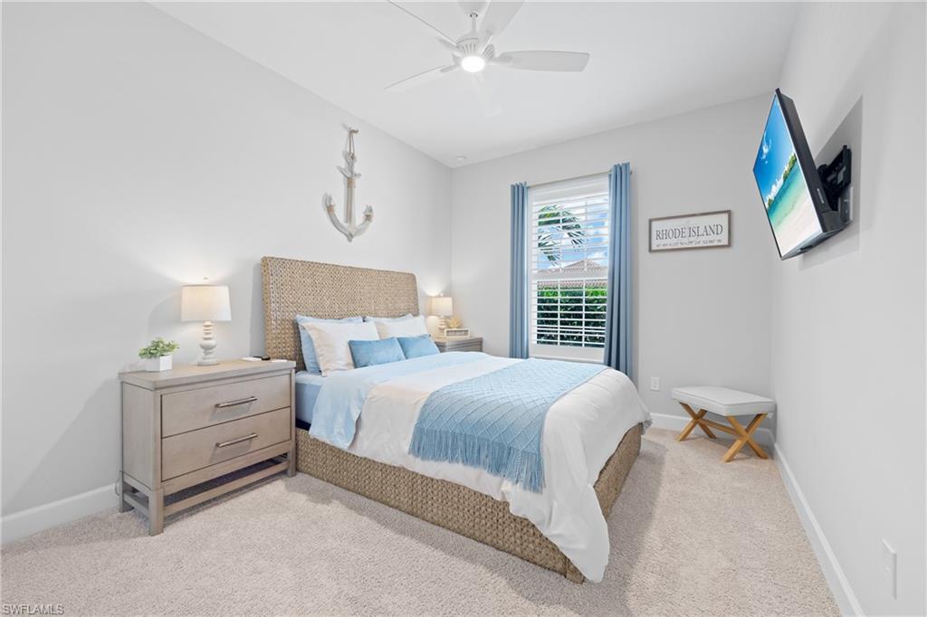 15214 Tolmino Street Naples, FL 34114 - Photo 20 of 47 a bedroom with a bed and a window