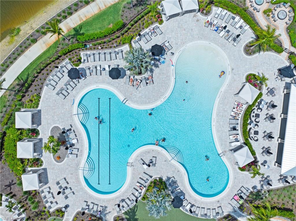15214 Tolmino Street Naples, FL 34114 - Photo 45 of 47 an aerial view of a swimming pool with outdoor seating