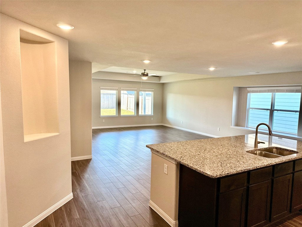 5322 Briana Dee Drive Rosharon, TX 77583 - Photo 5 of 20 a kitchen with a sink cabinets and wooden floor
