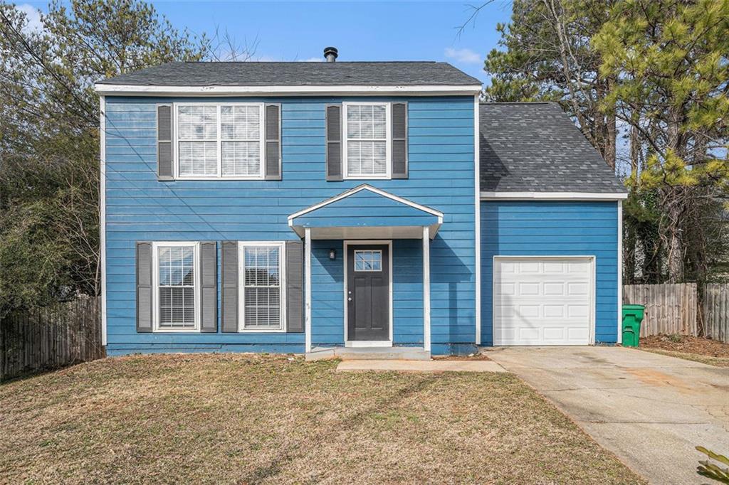 3530 Kingsbrooke Court Decatur, GA 30034 - Photo 1 of 1 a front view of a house with a yard and garage