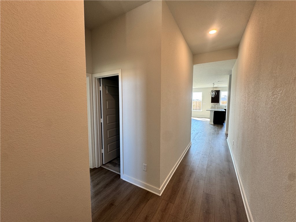 2409 Rooke Road Bryan, TX 77807 - Photo 2 of 11 a view of a hallway with wooden floor