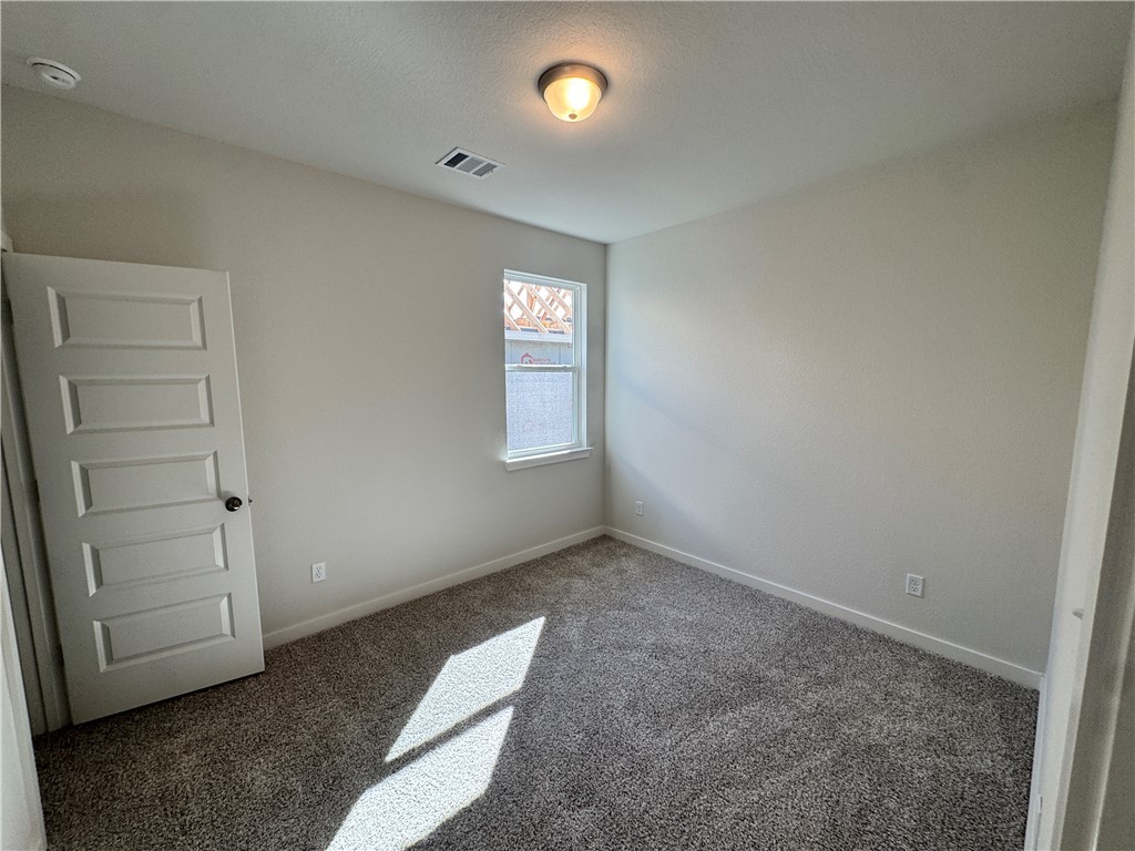 2409 Rooke Road Bryan, TX 77807 - Photo 5 of 11 an empty room with closet and window