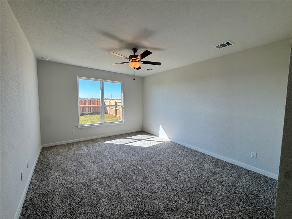 2409 Rooke Road Bryan, TX 77807 - Photo 9 of 11 a view of empty room with ceiling fan
