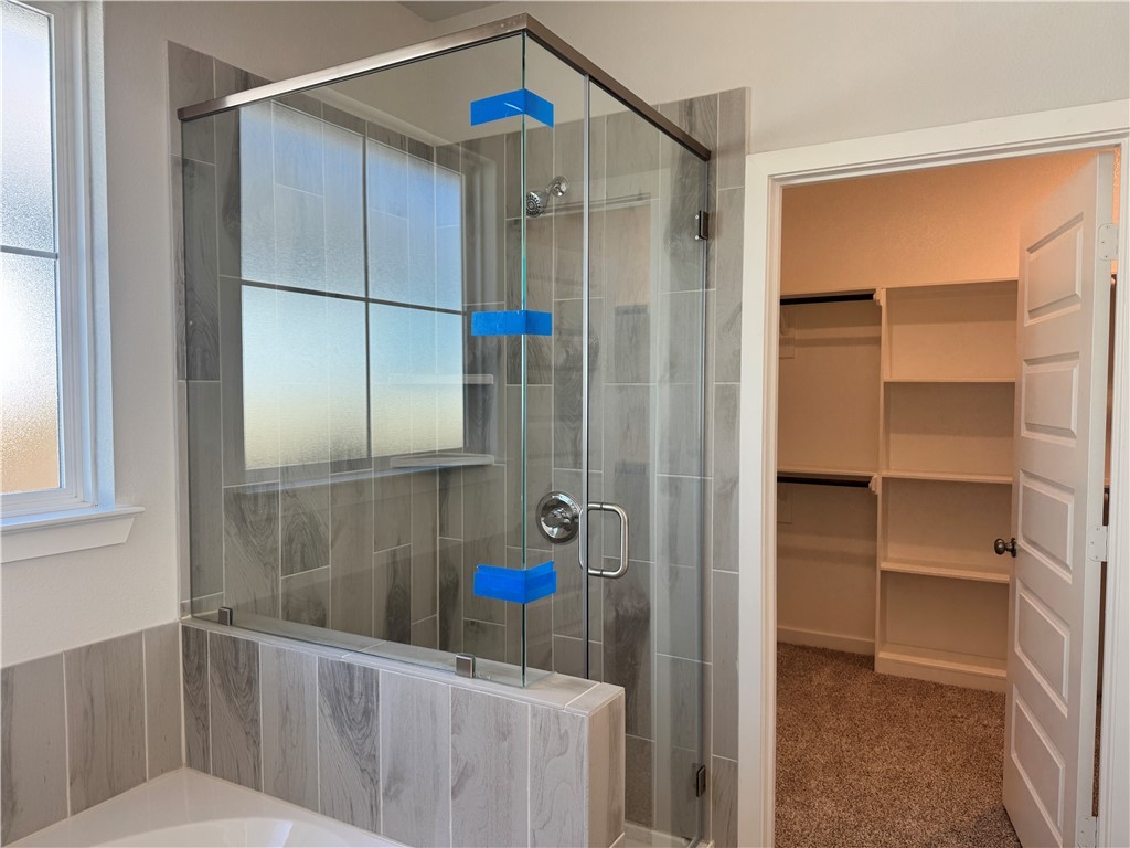 2409 Rooke Road Bryan, TX 77807 - Photo 10 of 11 a bathroom with a shower and a toilet