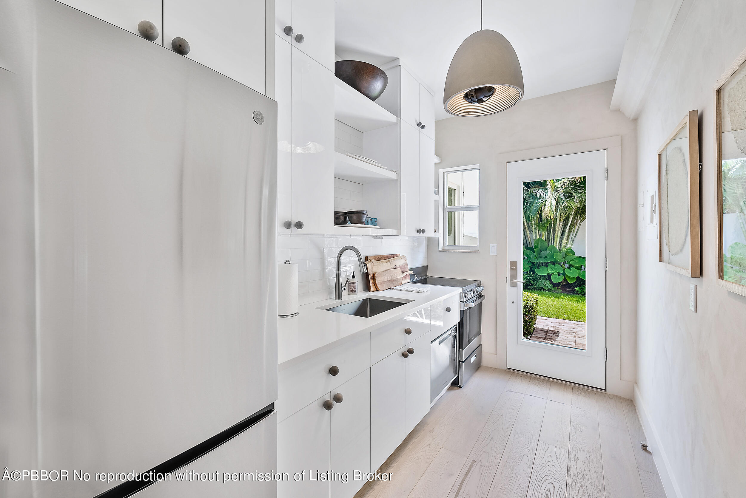 220 Atlantic Avenue, Unit 3 Palm Beach, FL 33480 - Photo 11 of 36 a bathroom with a sink and a mirror