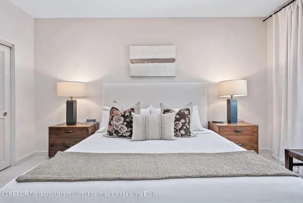 a living room with furniture and a lamp