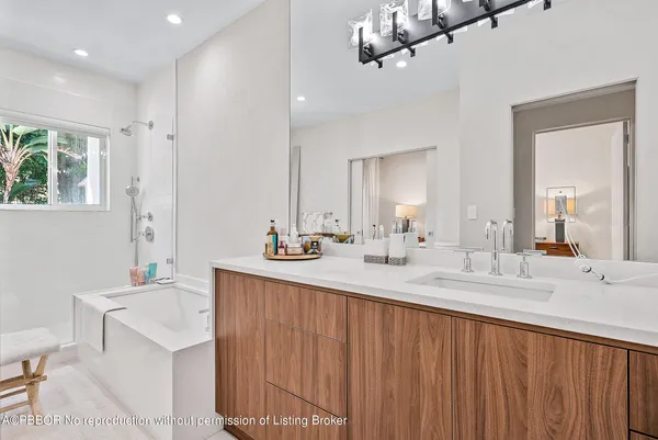 a bathroom with a sink double vanity and a mirror