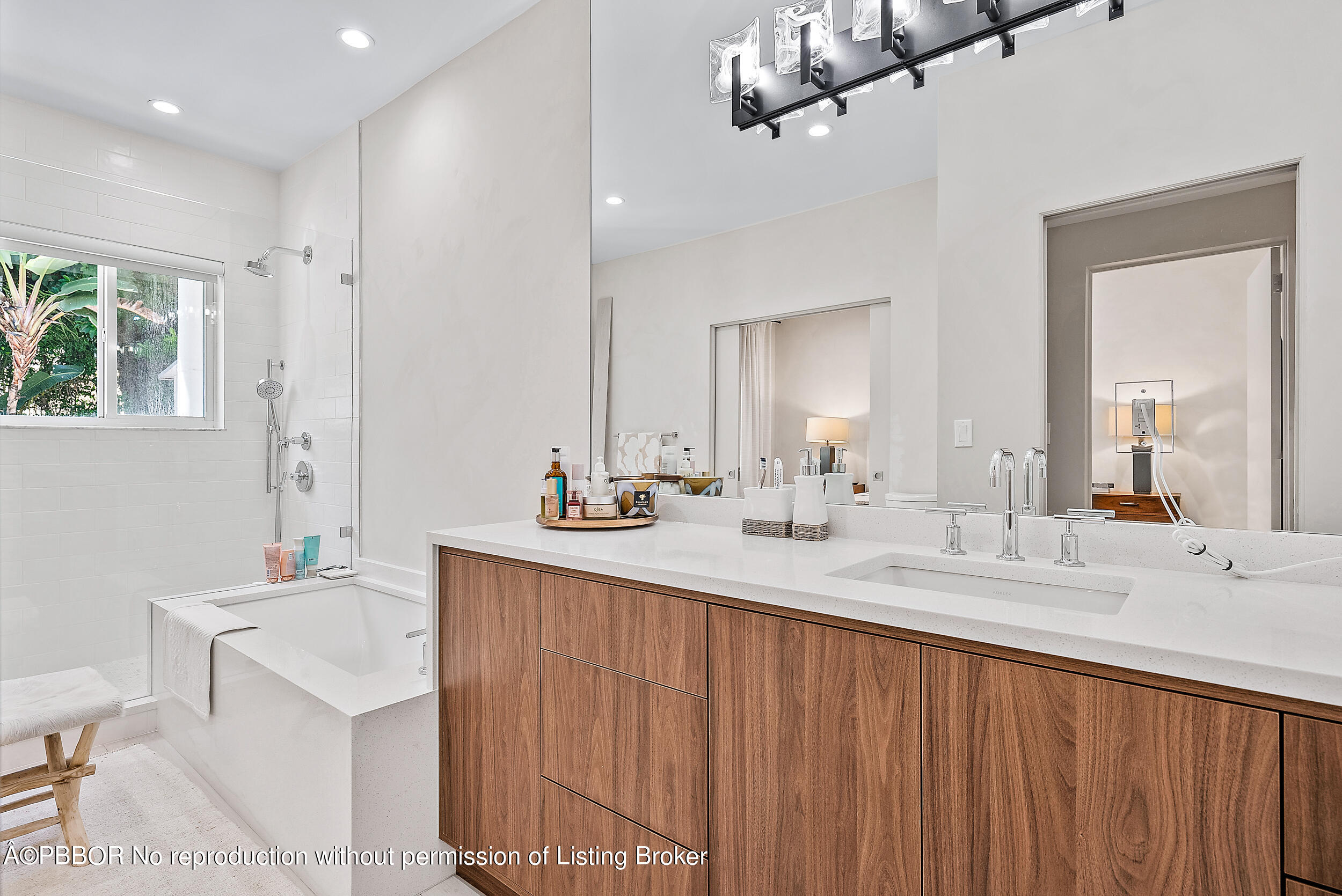 220 Atlantic Avenue, Unit 3 Palm Beach, FL 33480 - Photo 18 of 36 a bathroom with a sink double vanity and a mirror