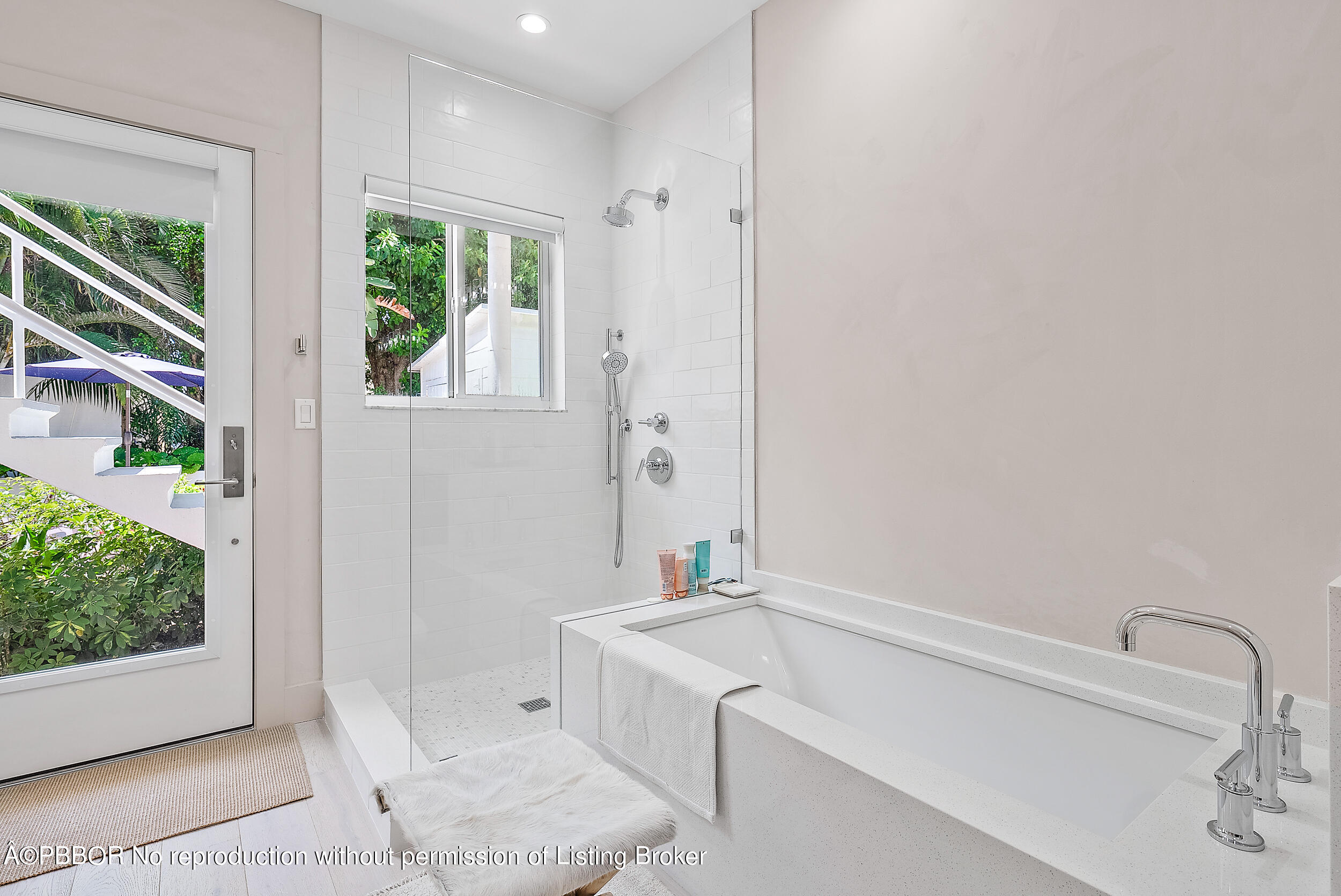 220 Atlantic Avenue, Unit 3 Palm Beach, FL 33480 - Photo 19 of 36 a bathroom with a tub sink and window