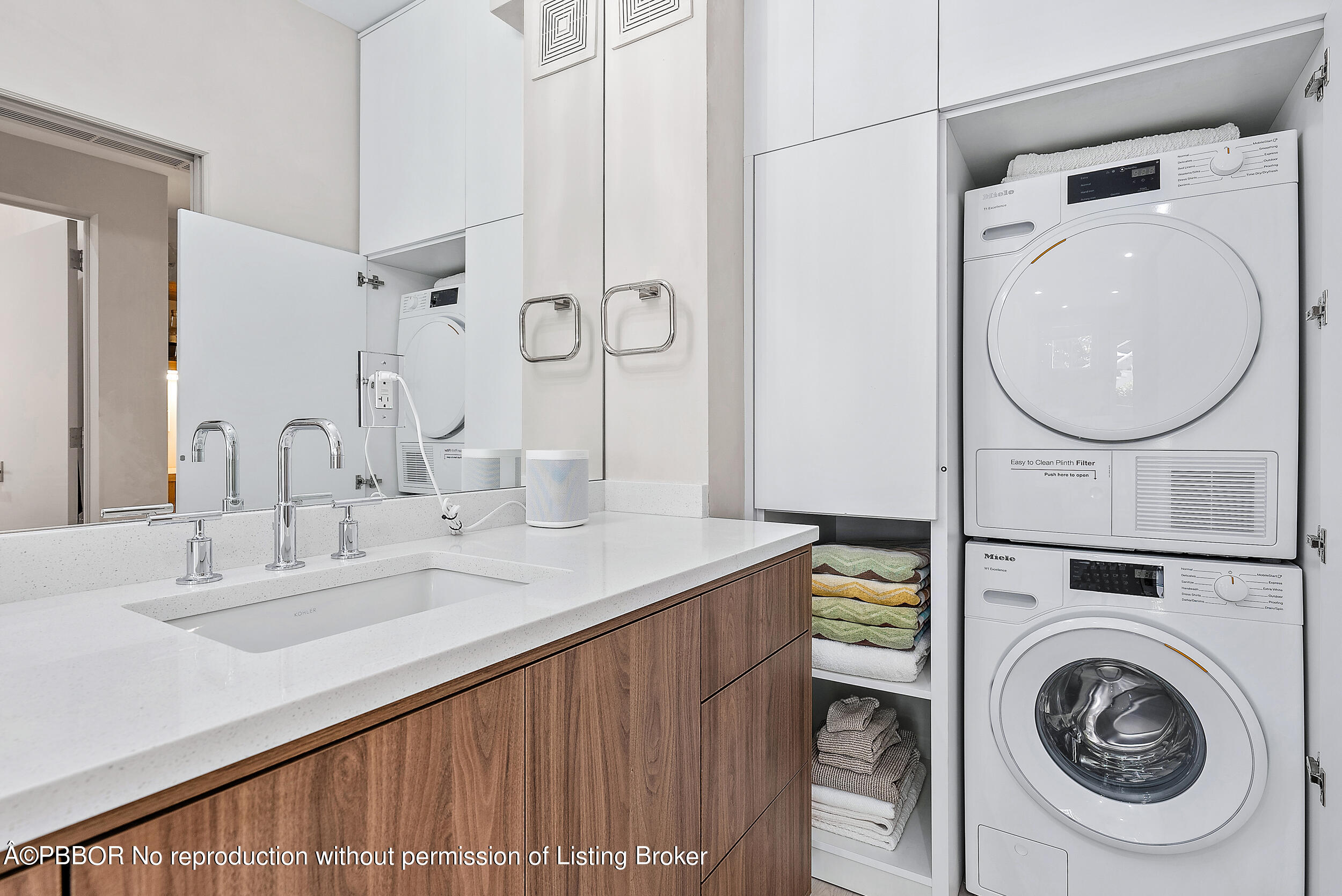 220 Atlantic Avenue, Unit 3 Palm Beach, FL 33480 - Photo 20 of 36 a en suite bathroom with a granite countertop sink and a mirror