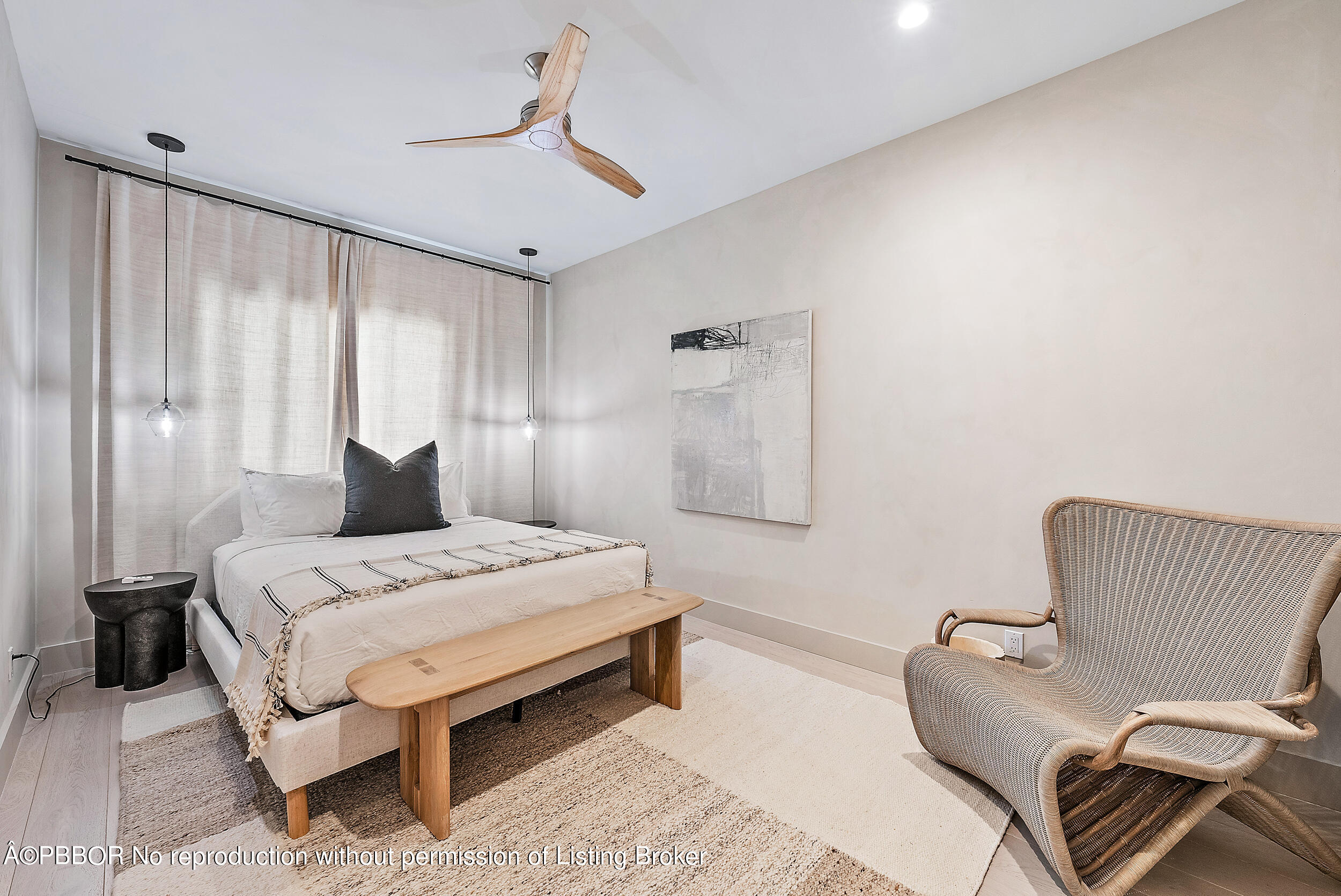 220 Atlantic Avenue, Unit 3 Palm Beach, FL 33480 - Photo 21 of 36 a bedroom with a bed and a couch