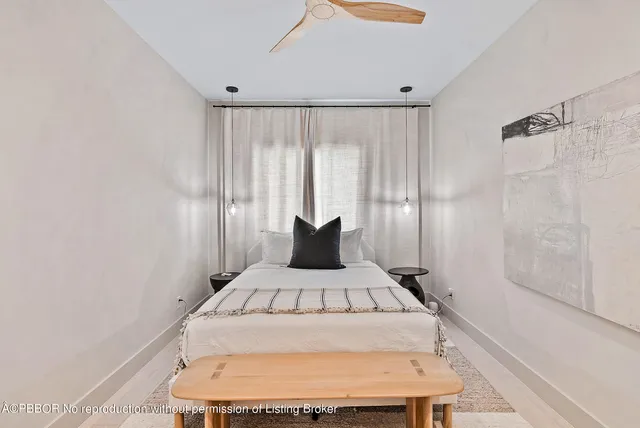 a room with a bed and a window