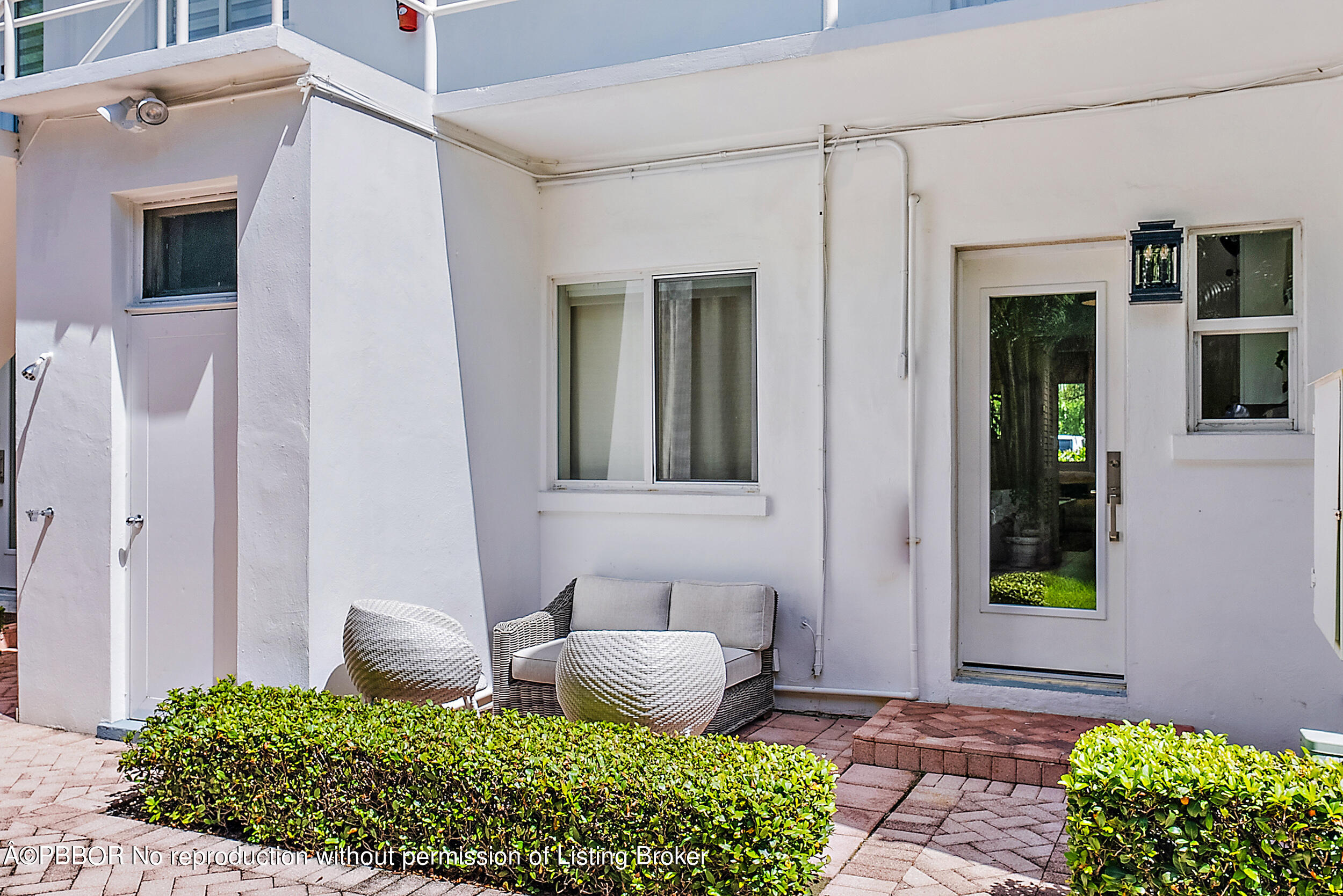 220 Atlantic Avenue, Unit 3 Palm Beach, FL 33480 - Photo 27 of 36 a front view of a house with garden