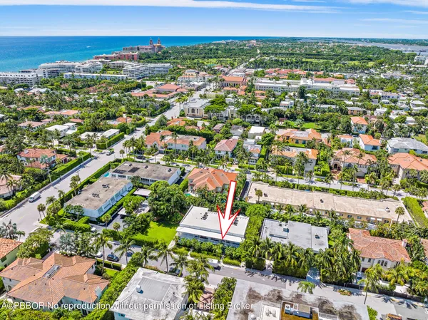 an aerial view of residential houses with city view