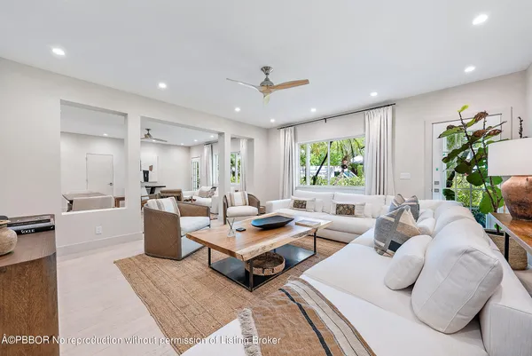 a living room with furniture rug and window