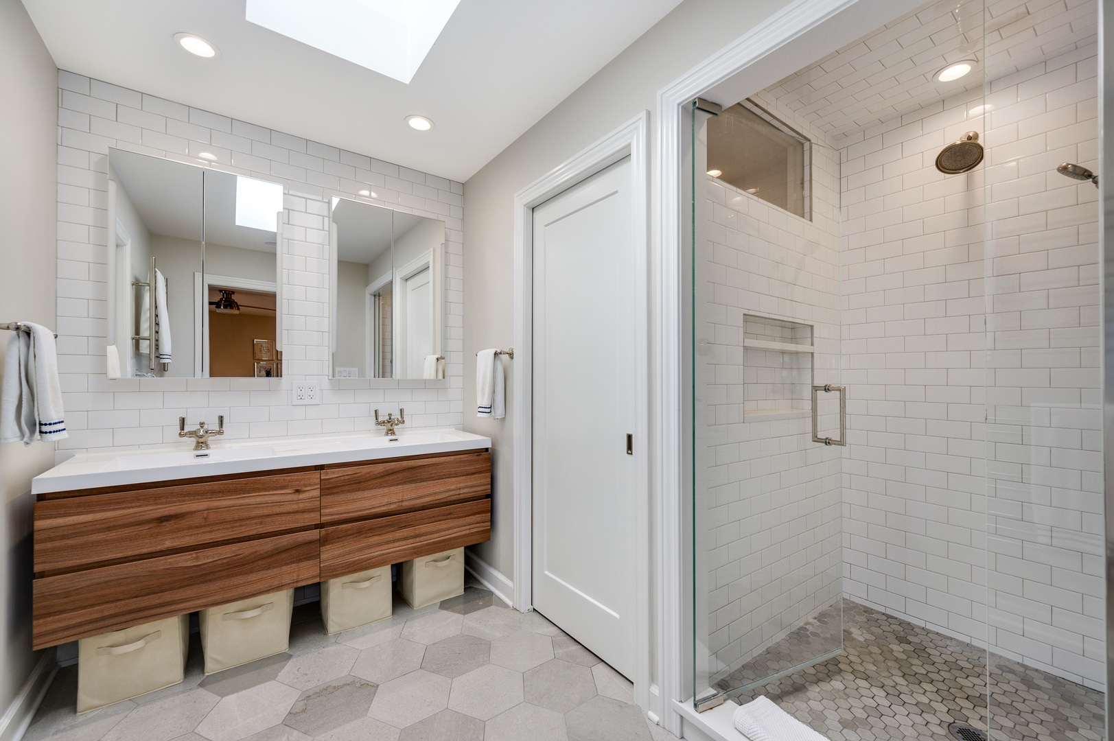 2200 Swainwood Drive Glenview, IL 60025 - Photo 17 of 31 a bathroom with a sink a toilet and mirror