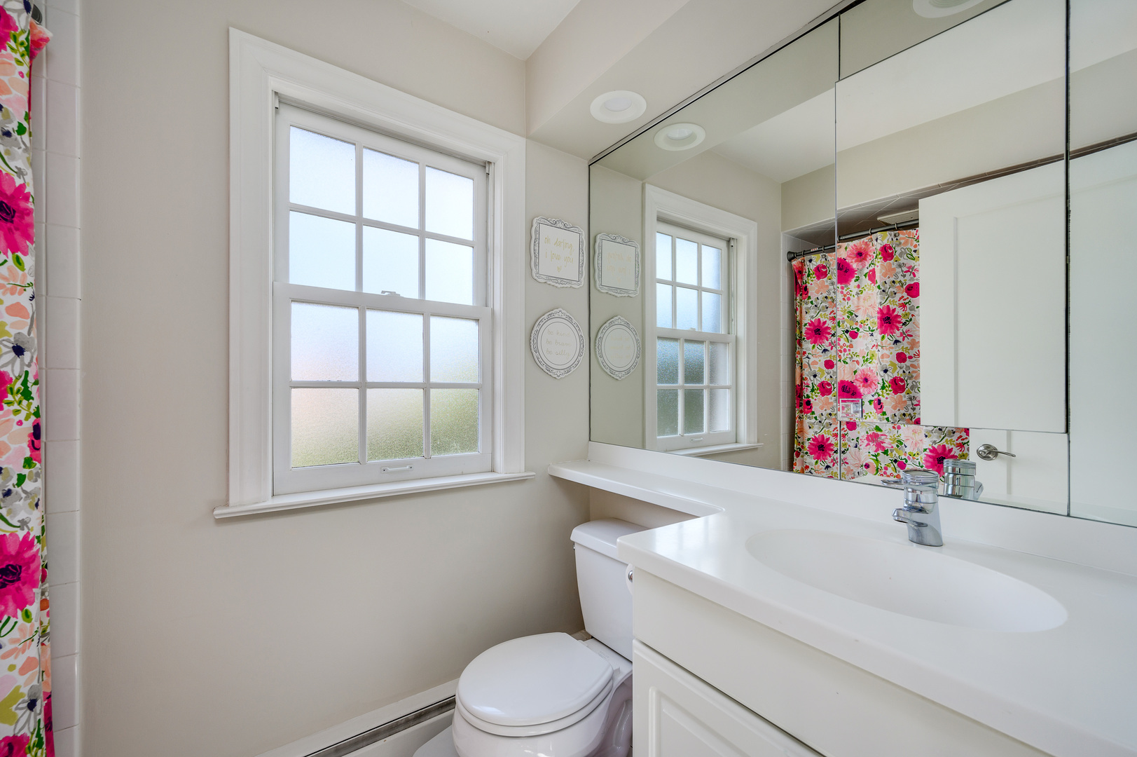 2200 Swainwood Drive Glenview, IL 60025 - Photo 20 of 31 a bathroom with a sink toilet and window