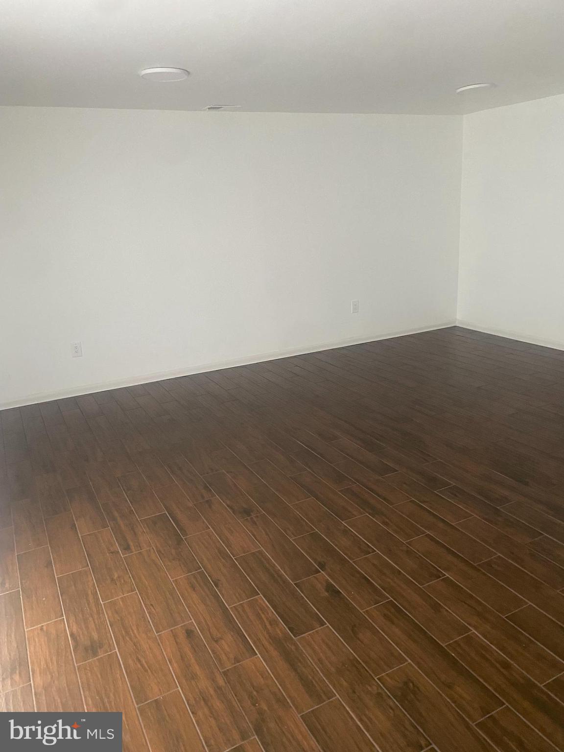 11393 Laurelwalk Drive, Unit B141 Laurel, MD 20708 - Photo 7 of 8 a view of wooden floor in a room